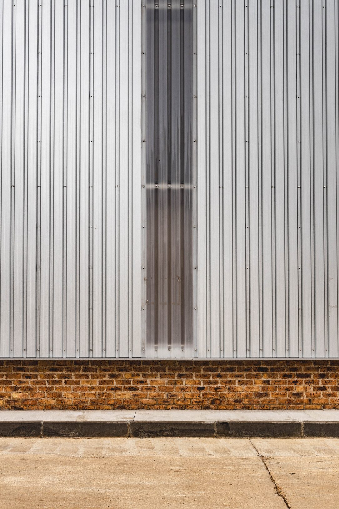 View of Warehouse wall and window letting light in
