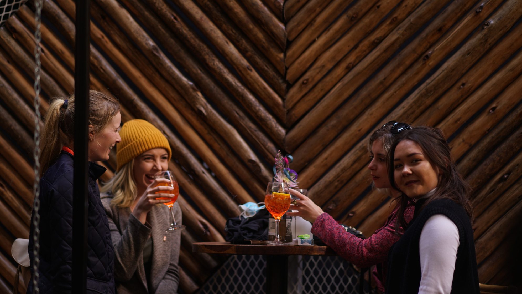 The Yard - Sin & Tax - Patrons enjoying drinks at a table